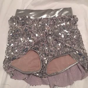 Glittery shorts, skirt around it cut out in front